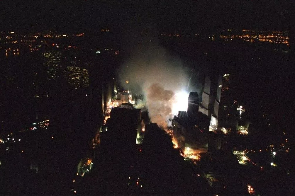 Original Caption: The World Trade Center rescue site in New York City is seen the evening of Friday, Sept. 14, 2001, from Marine One. (U.S. National Archives’ Local Identifier: P7379-35)